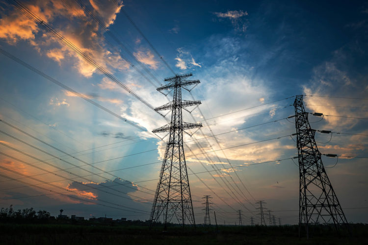 Blue & pink sky with powerlines and pylons